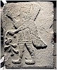 Winged genie on three sided orthostat